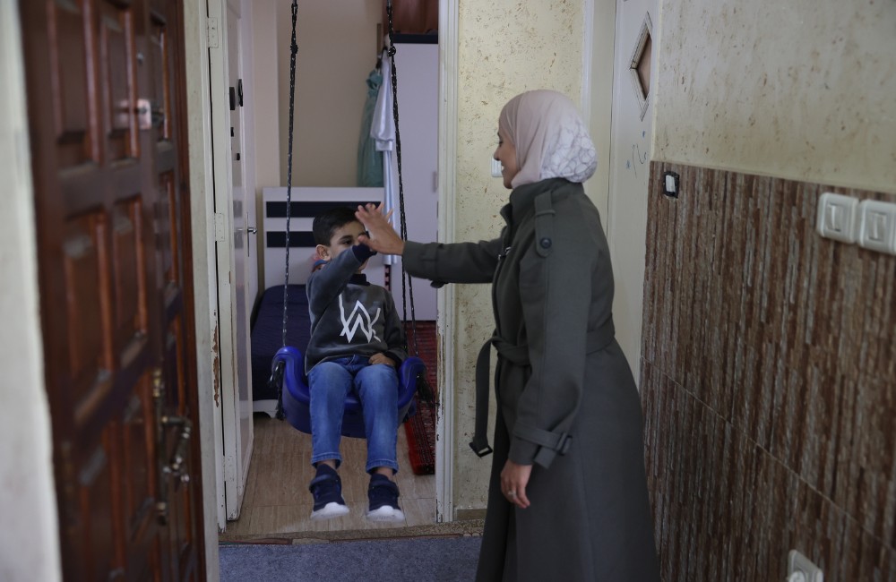 World Autism Day - an autistic boy sitting in a swing