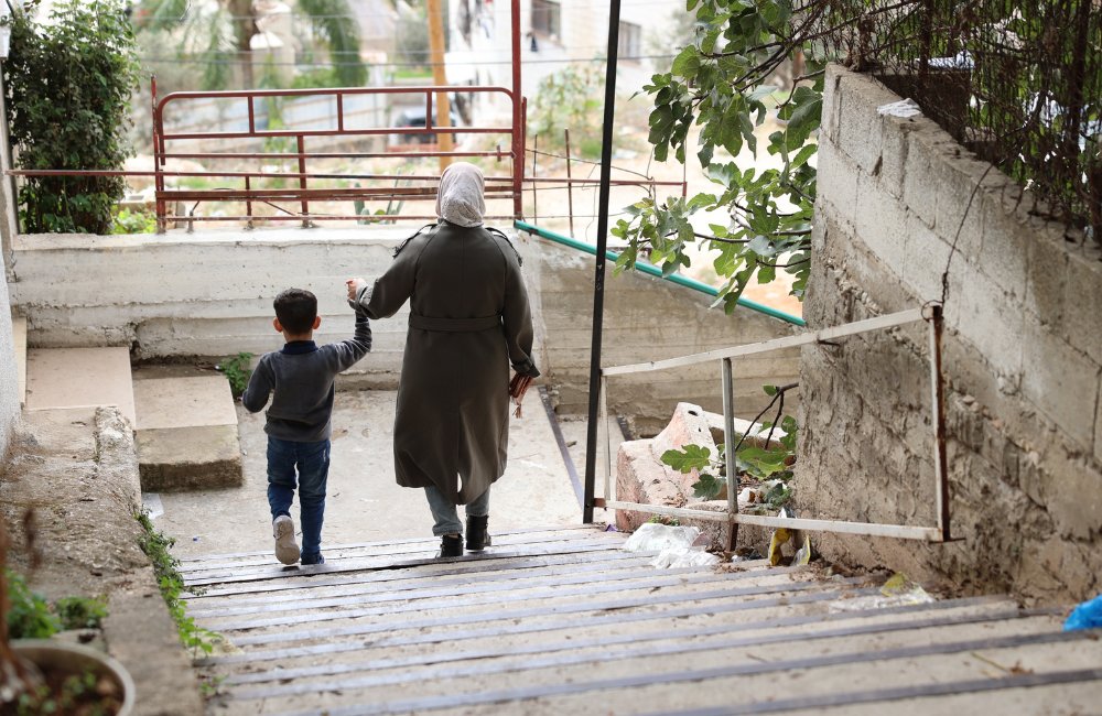 World Autism Day - a mother and son walk down some steps